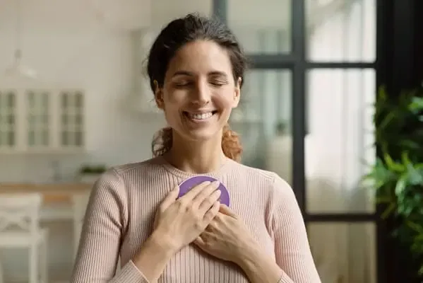 Quantum Booster on chest woman standing eyes closed